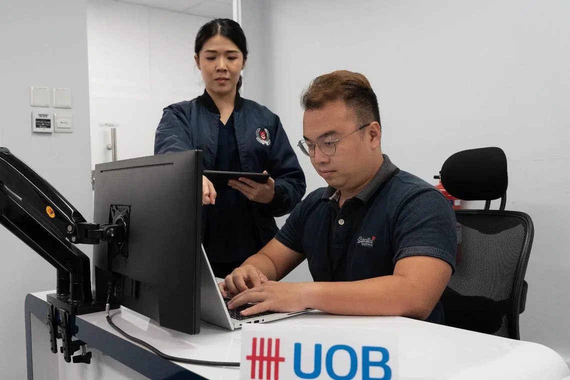 An Anti-Scam Centre officer working together with UOB Bank during the one-month joint operation.