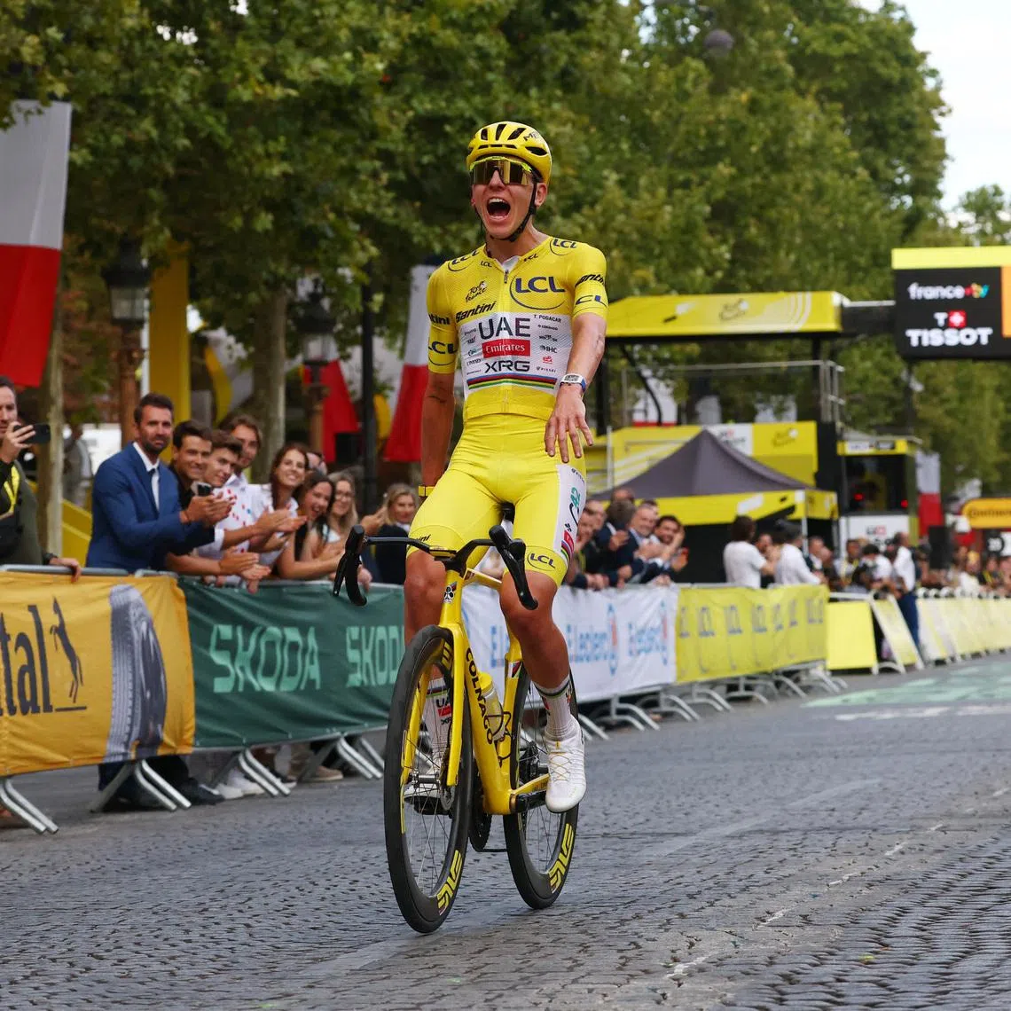 Cycling - Tour de France - Stage 21 - Paris, France - July 26, 2026 UAE Team Emirates XRG's Tadej Pogacar wearing the yellow jersey celebrates after completing stage 21 REUTERS/Gonzalo Fuentes