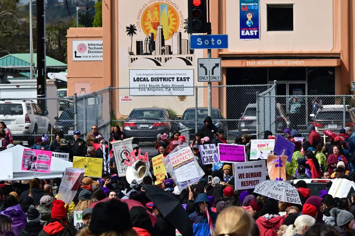 Los Angeles public school support staff, teachers, and supporters rally at the Los Angeles Unified School District local district offices on March 22, 2023 in Los Angeles, California.