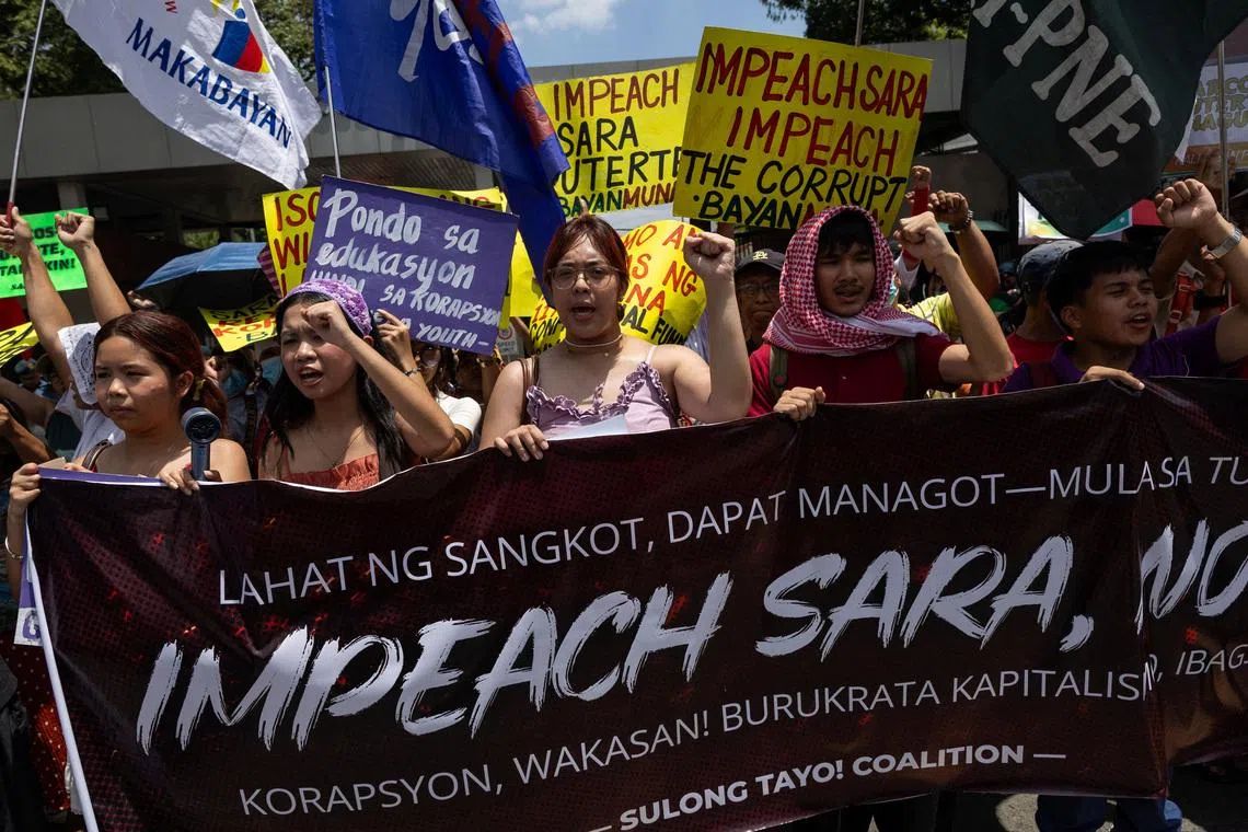 Protesters call for the impeachment of Philippine Vice President Sara Duterte ahead of a vote in the House of Representatives on whether to transmit the impeachment complaint to the Senate, outside the House of Representatives in Quezon City, Philippines, May 11, 2026. REUTERS/Eloisa Lopez