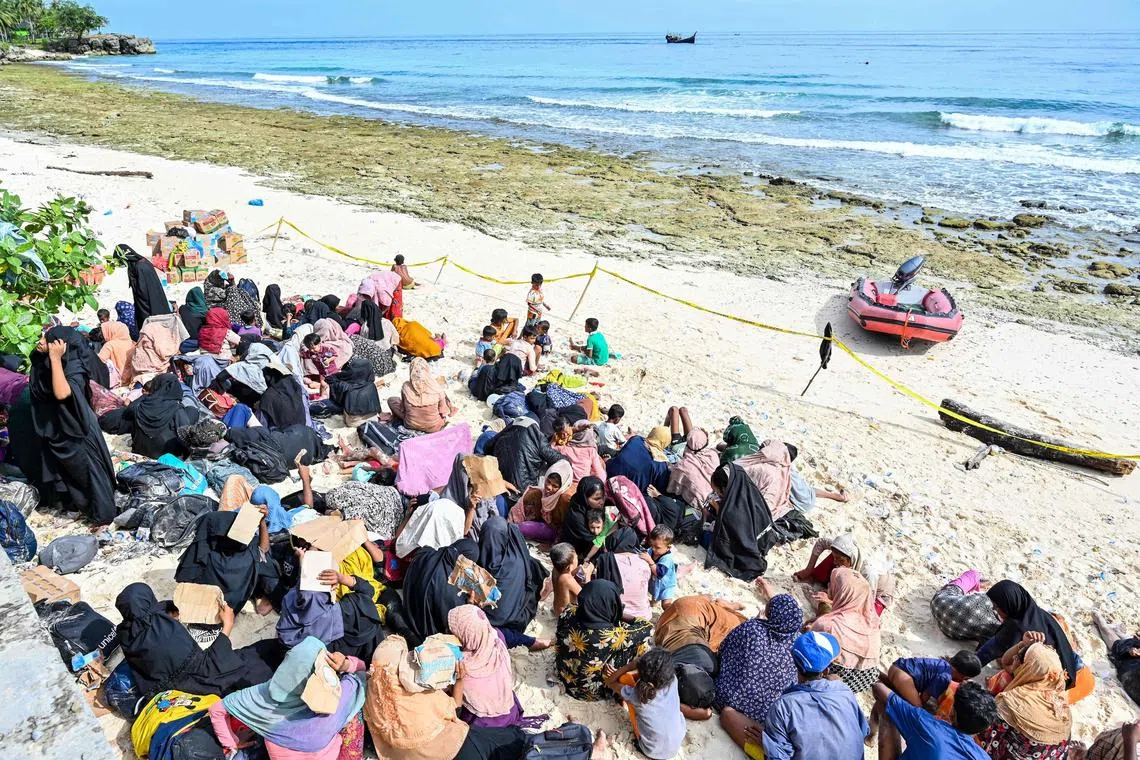 Newly-arrived Rohingya refugees rest on a beach in Sabang island, Aceh province, on Nov 22, 2023.