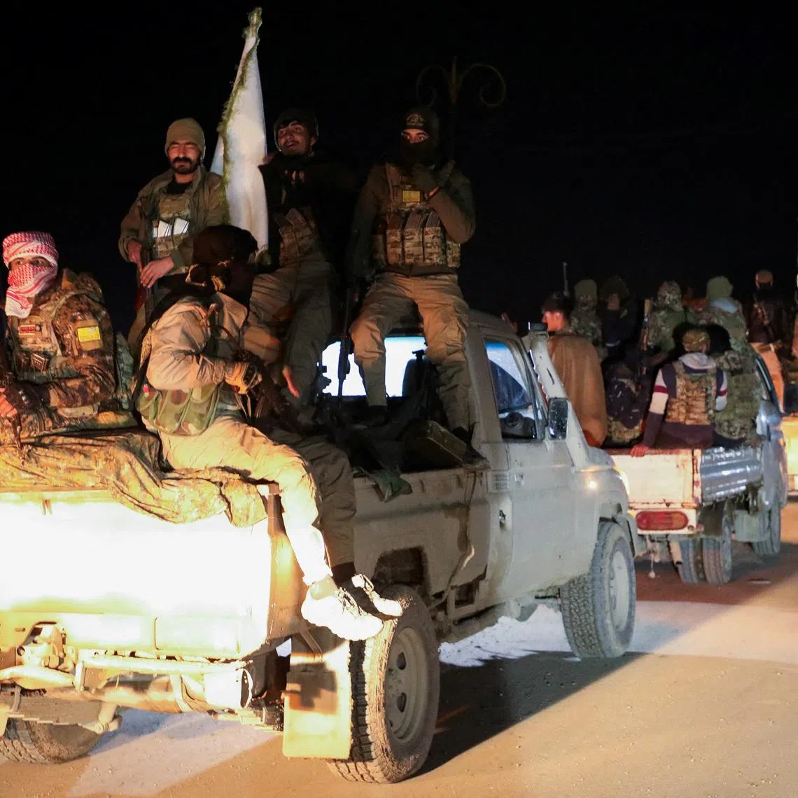 FILE PHOTO: Syrian Democratic Forces vehicles withdraw from the front lines following an agreement between the Syrian government and the Syrian Democratic Forces, in Hasakah, Syria February 10, 2026. REUTERS/Orhan Qereman/File Photo