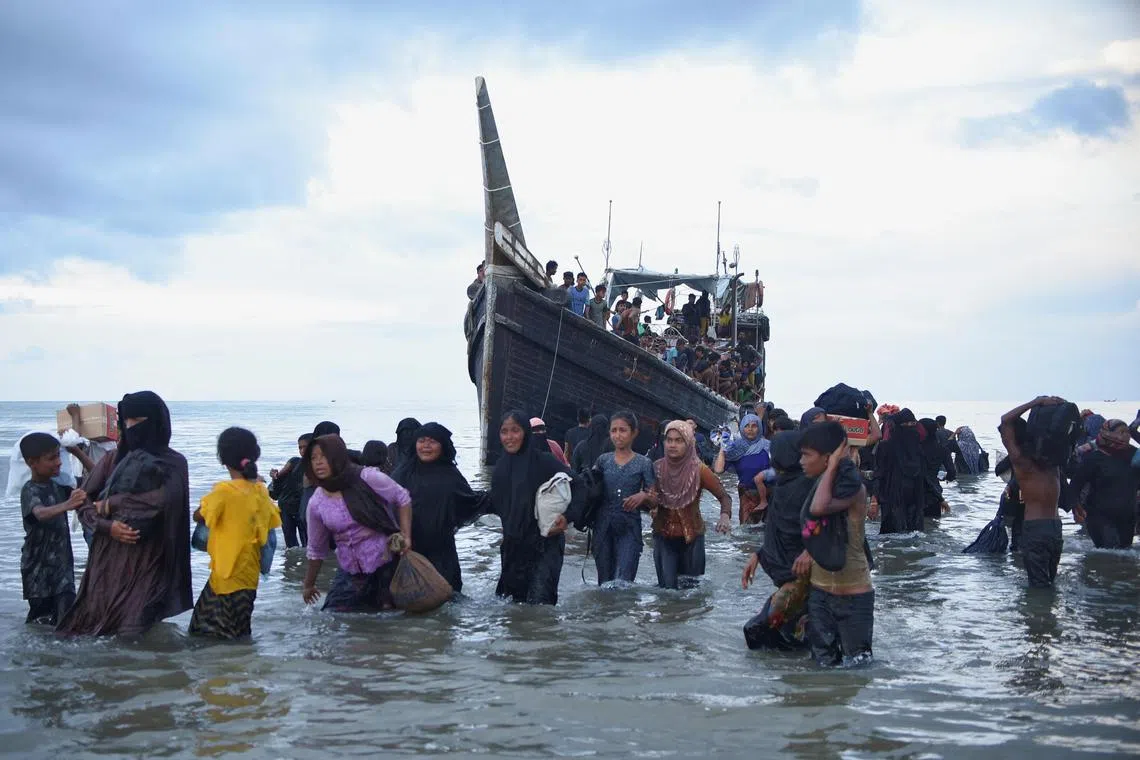 Rohingya Muslims are temporarily allowed by locals to land on Ulee Madon beach, North Aceh.