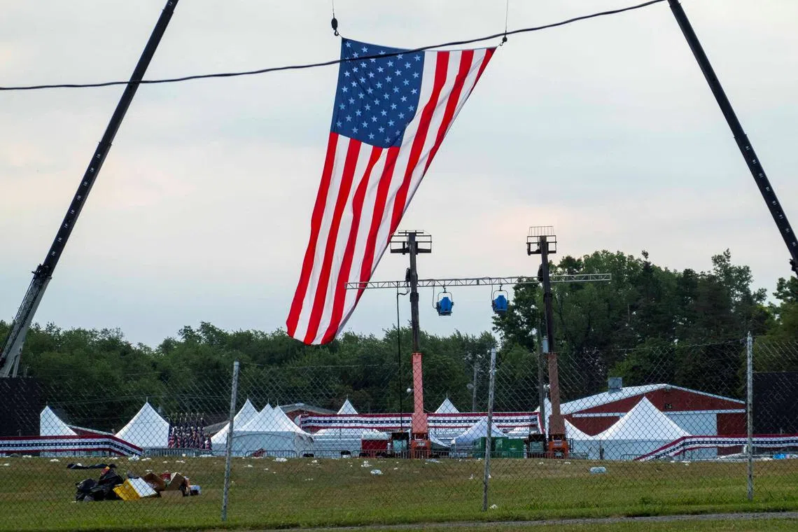 FILE PHOTO: A flag hung over the stage waves in the wind at the event grounds where the rally was held, during the law enforcement investigation into gunfire at a campaign rally of Republican presidential candidate and former U.S. President Donald Trump in Butler, Pennsylvania, U.S. July 15, 2024. REUTERS/Carlos Osorio
