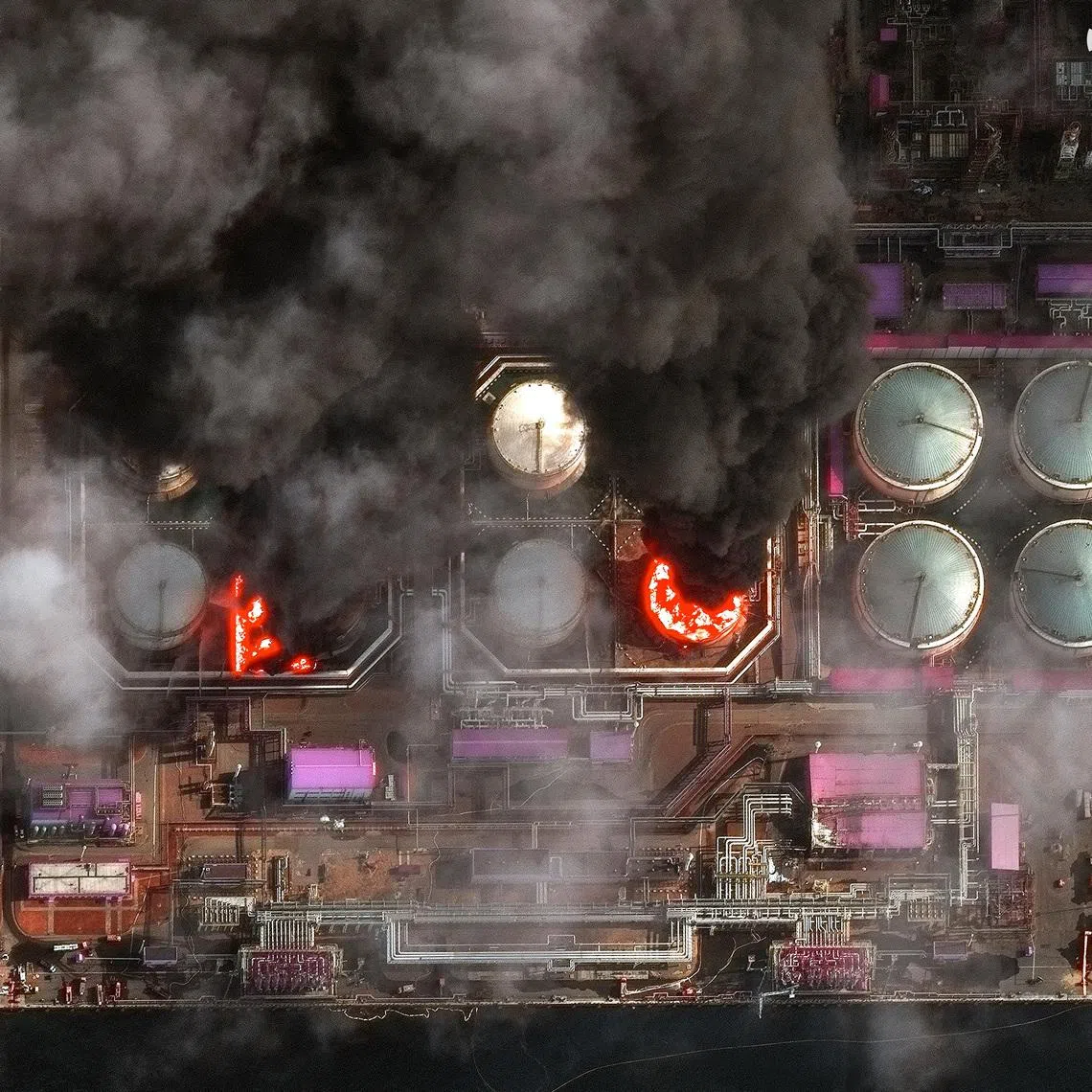 A satellite near-infrared image shows smoke rising from oil storage tanks at Russia's Baltic Sea port of Ust-Luga, which was struck multiple times in Ukrainian attacks, in Ust-Luga, Russia March 29, 2026. Vantor/Handout via REUTERS