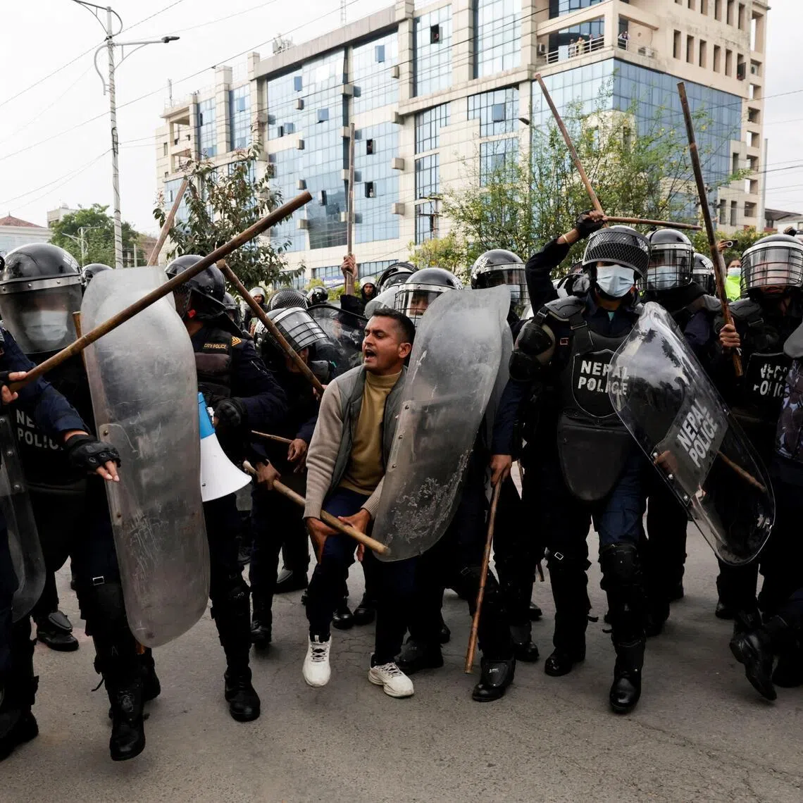 Police officials clash with a supporter of Nepal’s former prime minister K.P. Sharma Oli during a protest following Mr Oli’s detention by police, who are investigating whether he was negligent in preventing dozens of deaths during the Gen Z protests, in Kathmandu, Nepal, on March 29, 2026.