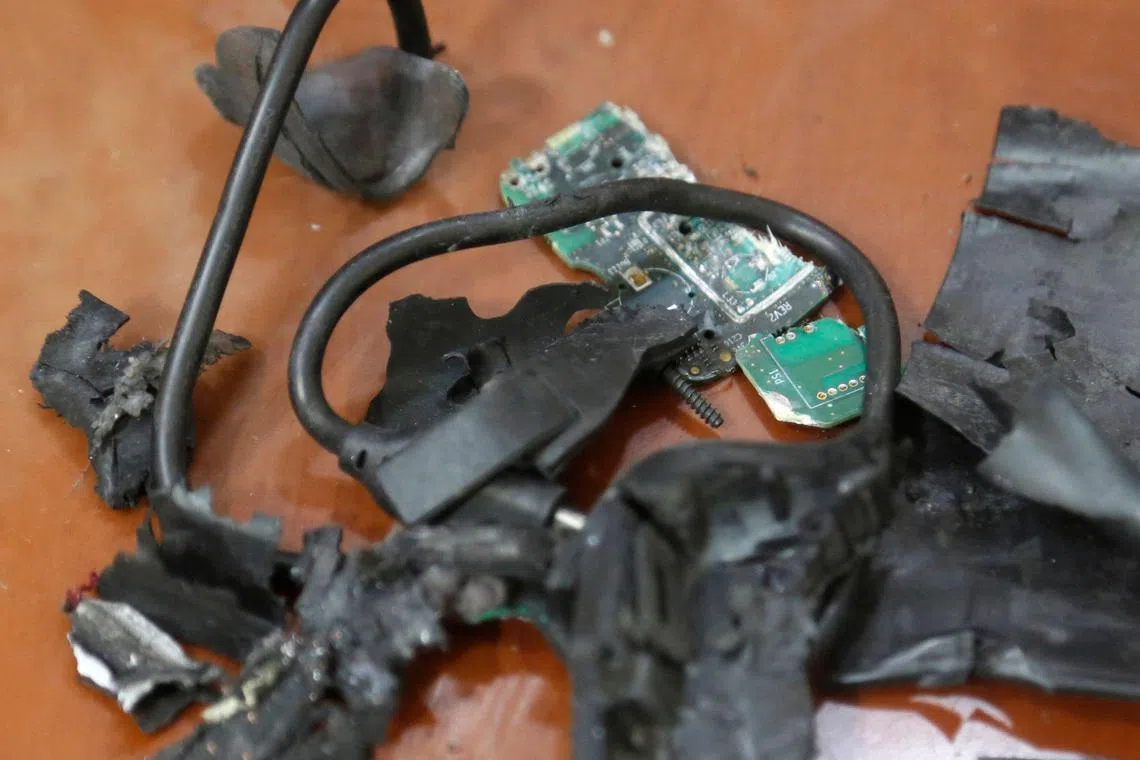 A photo taken on Sept 18, in Beirut's southern suburbs shows the remains of exploded pagers on display at an undisclosed location.