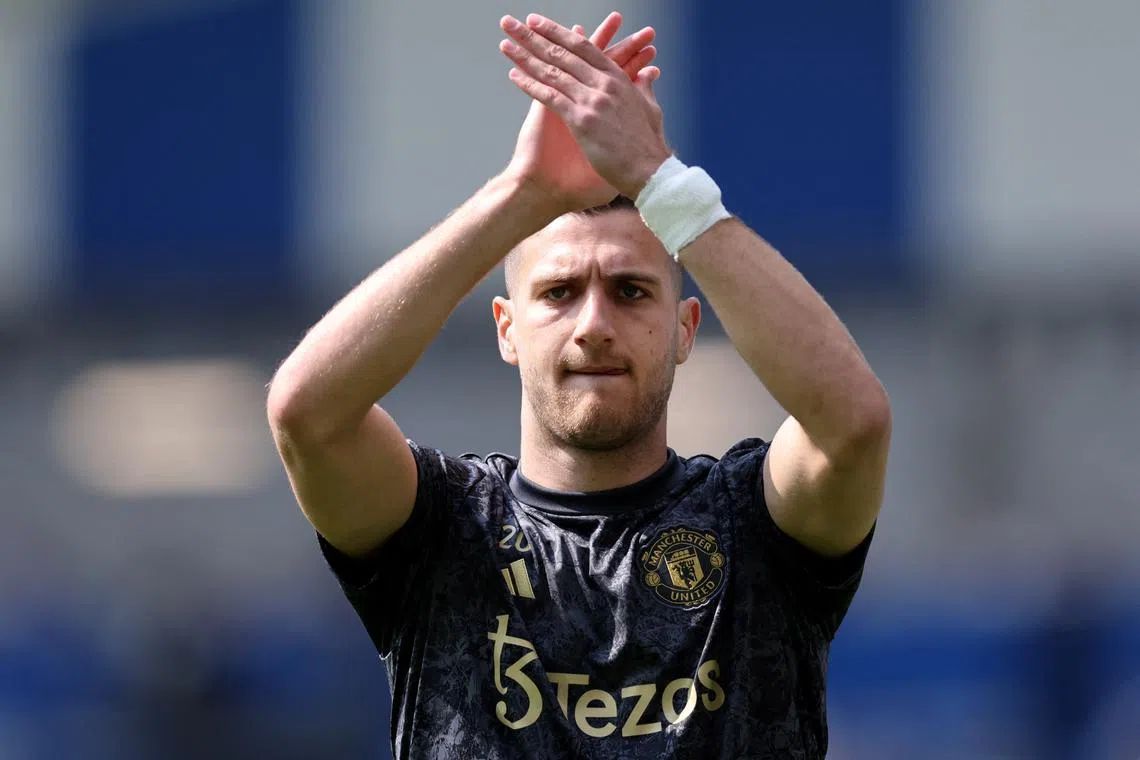 FILE PHOTO: Soccer Football - Premier League - Brighton & Hove Albion v Manchester United - The American Express Community Stadium, Brighton, Britain - May 19, 2024  Manchester United's Diogo Dalot during the warm up before the match REUTERS/David Klein/File Photo