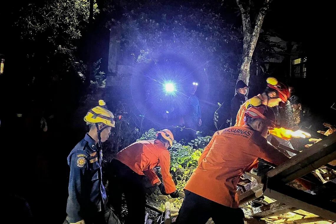 Rescuers searching for survivors after a landslide hit a village in Cilacap, Indonesia, on Nov 13, 2025.