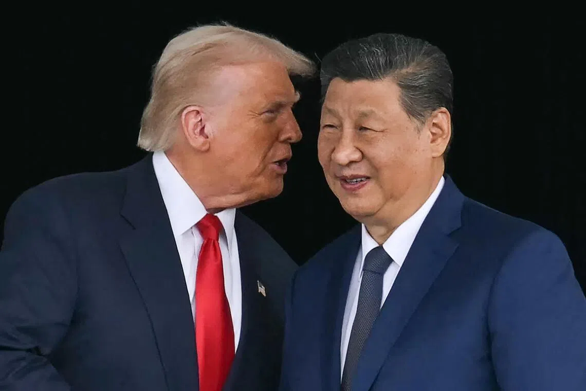 US President Donald Trump (left) and China's President Xi Jinping after their talks at the Gimhae Air Base, in Busan, South Korea on Oct 30.