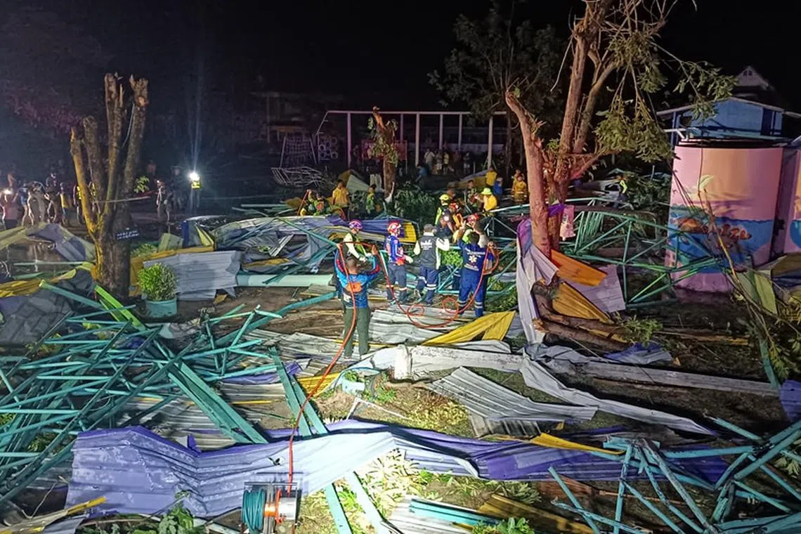First responders conducting search and rescue operations after a school sports field roof collapsed, in Thailand's Phichit Province, on May 22.