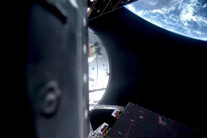 The Artemis II mission's Orion capsule leaves Earth on its way to fly by the moon, on April 1, in a still image from video.