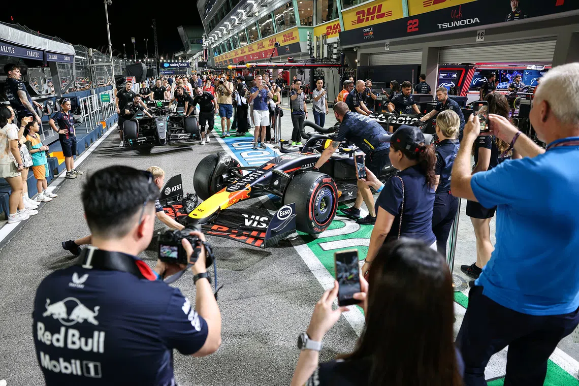 F1 fans walking the circuit after the qualifying session of the 2025 Formula One Singapore Airlines Singapore Grand Prix at the Marina Bay Street Circuit on Oct 4, 2025.  