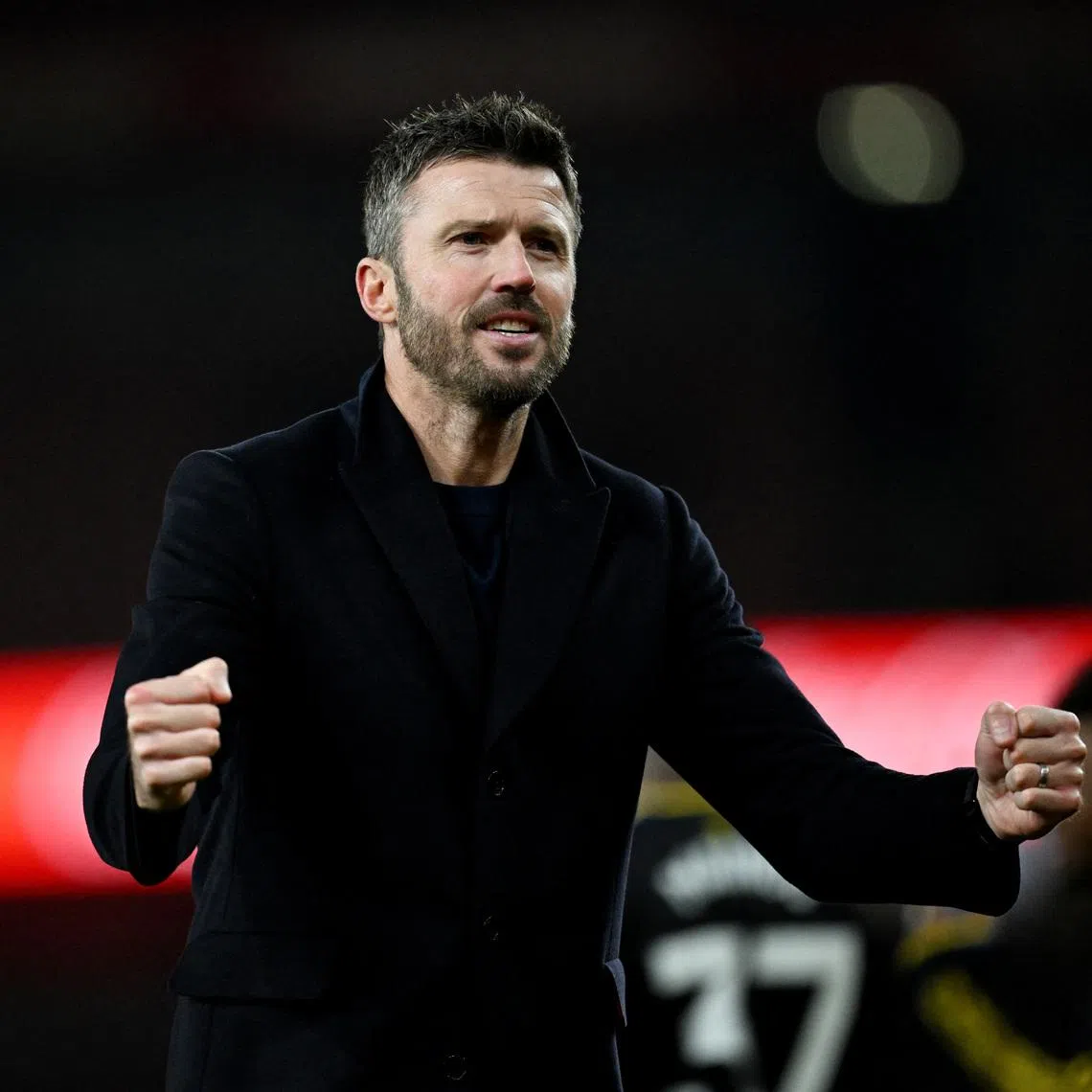 Manchester United manager Michael Carrick celebrating after the 3-2 English Premier League win over Arsenal at the Emirates Stadium on Jan 25.