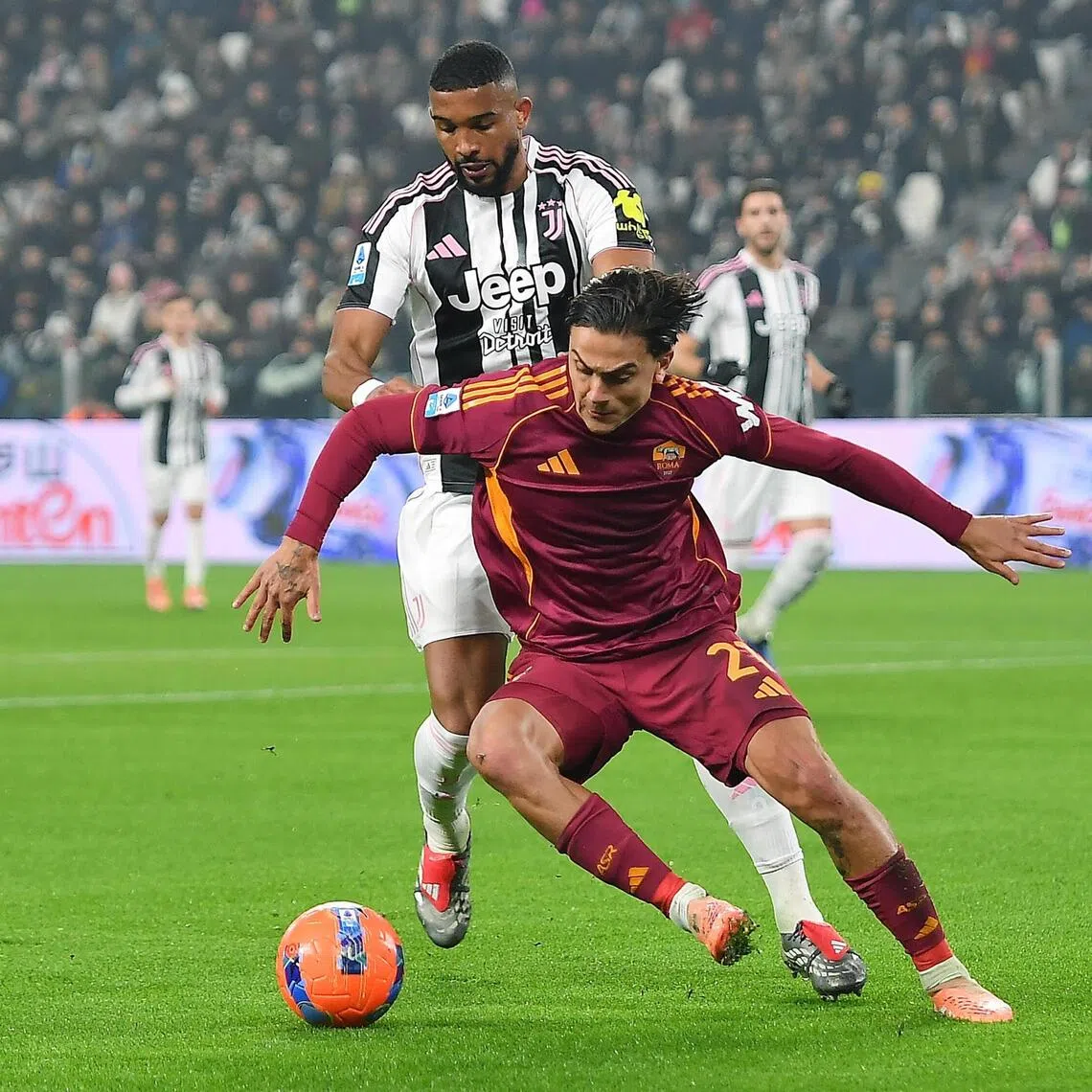 Juventus' Gleison Bremer closing down Roma's Paulo Dybala in their Italian Serie A soccer match between at the Allianz Stadium in Turin on Dec 20, 2025.