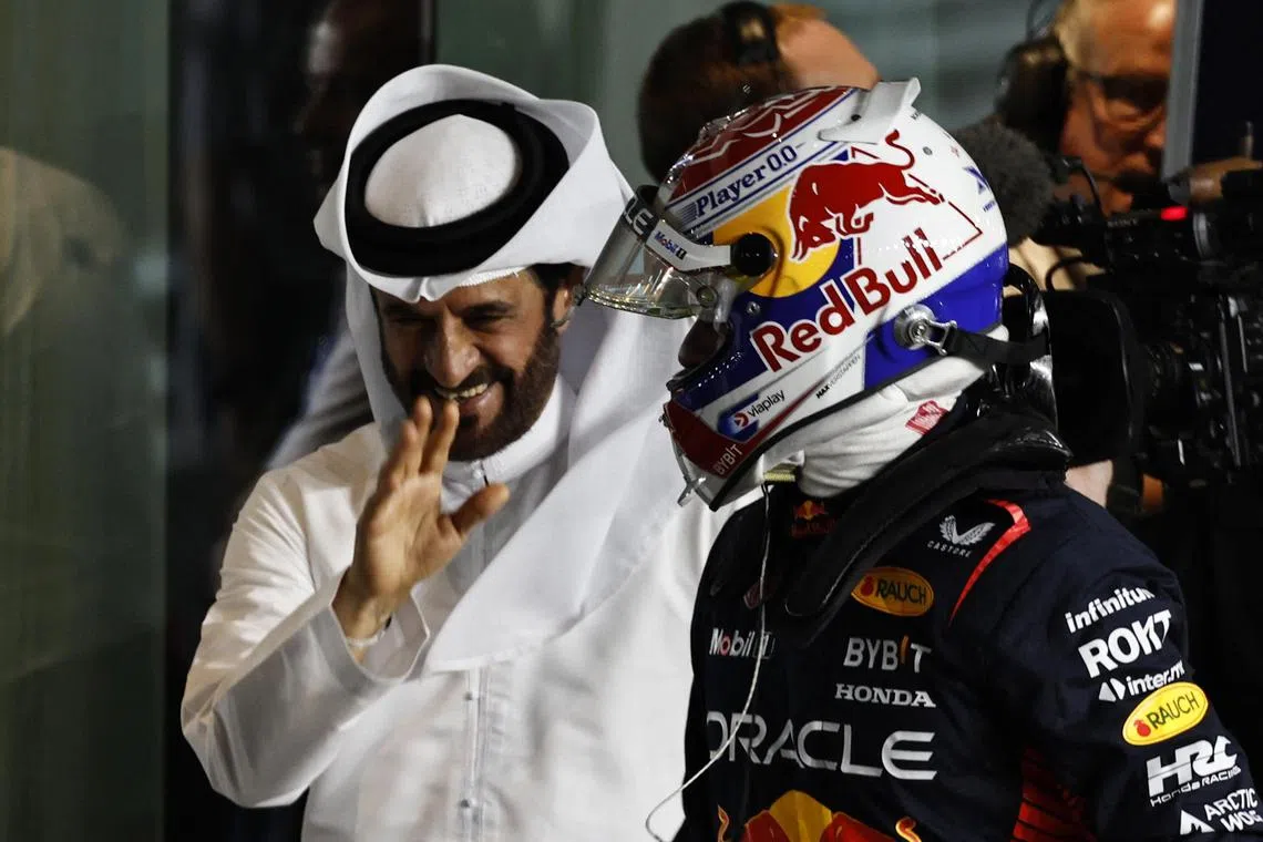 FIA president Mohammed ben Sulayem (left) with Red Bull's Max Verstappen at Qatar's Lusail International Circuit on Oct 6.