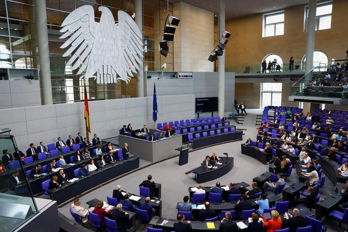 FILE PHOTO: German Chancellor Olaf Scholz answers questions from lawmakers during a plenum session of the lower house of parliament, in the Bundestag, in Berlin, Germany, July 3, 2024. REUTERS/Christian Mang/File Photo