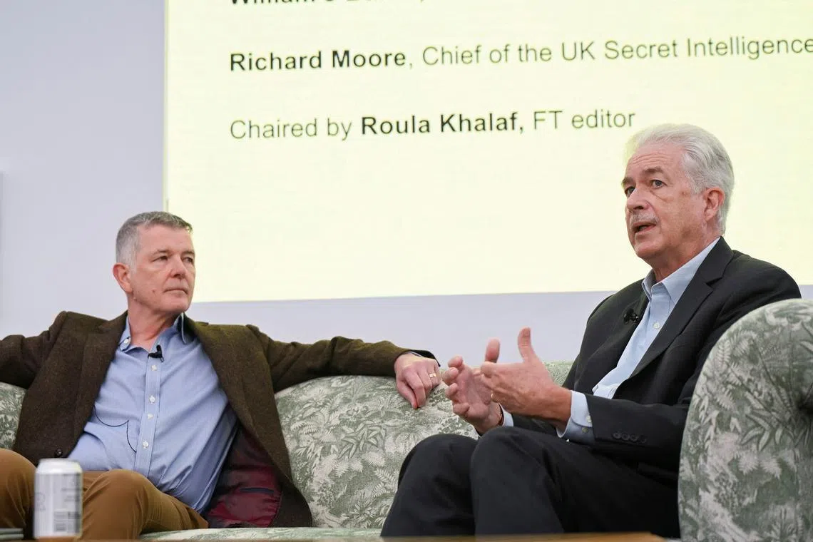 Britain's MI6 chief Richard Moore and US CIA Director Bill Burns speak during an interview in London, on Sept 7.