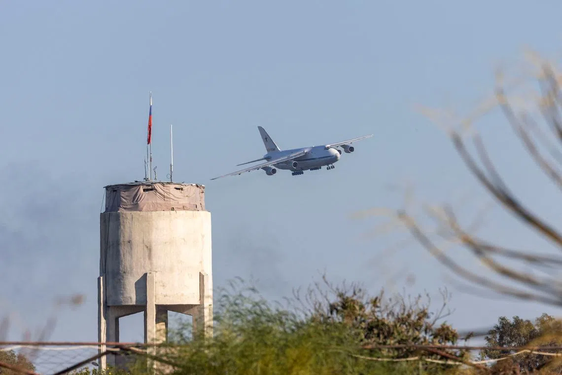 A Russian military aircraft approaches Hmeimim air base in Syria's coastal Latakia, Syria, December 14, 2024. REUTERS/Umit Bektas