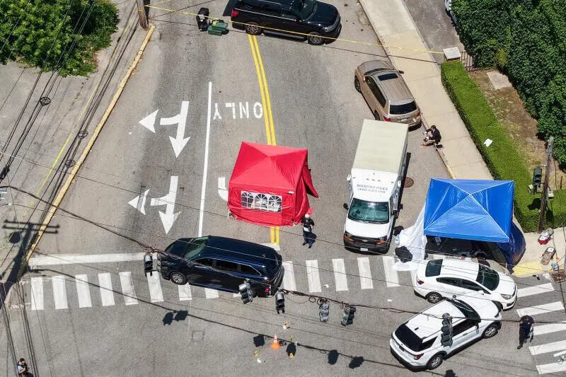 A drone view showing members of law enforcement working at the scene of a shooting involving US Immigration and Customs Enforcement (ICE) in Biddeford, Maine, on July 13, 2026.