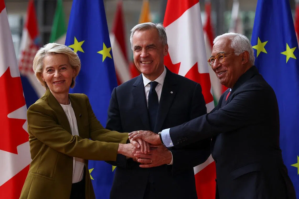 European Commission President Ursula von der Leyen and European Council President Antonio Costa welcome Canadian Prime Minister Mark Carney for an EU-Canada summit in Brussels, Belgium June 23, 2025. REUTERS/Gonzalo Fuentes