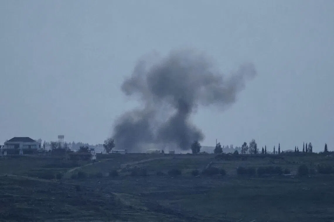 A photograph taken from the southern Lebanese district of Marjeyoun shows smoke as it rises from the site of an Israeli airstrike that targeted the village of Zawtar on March 22, 2026.