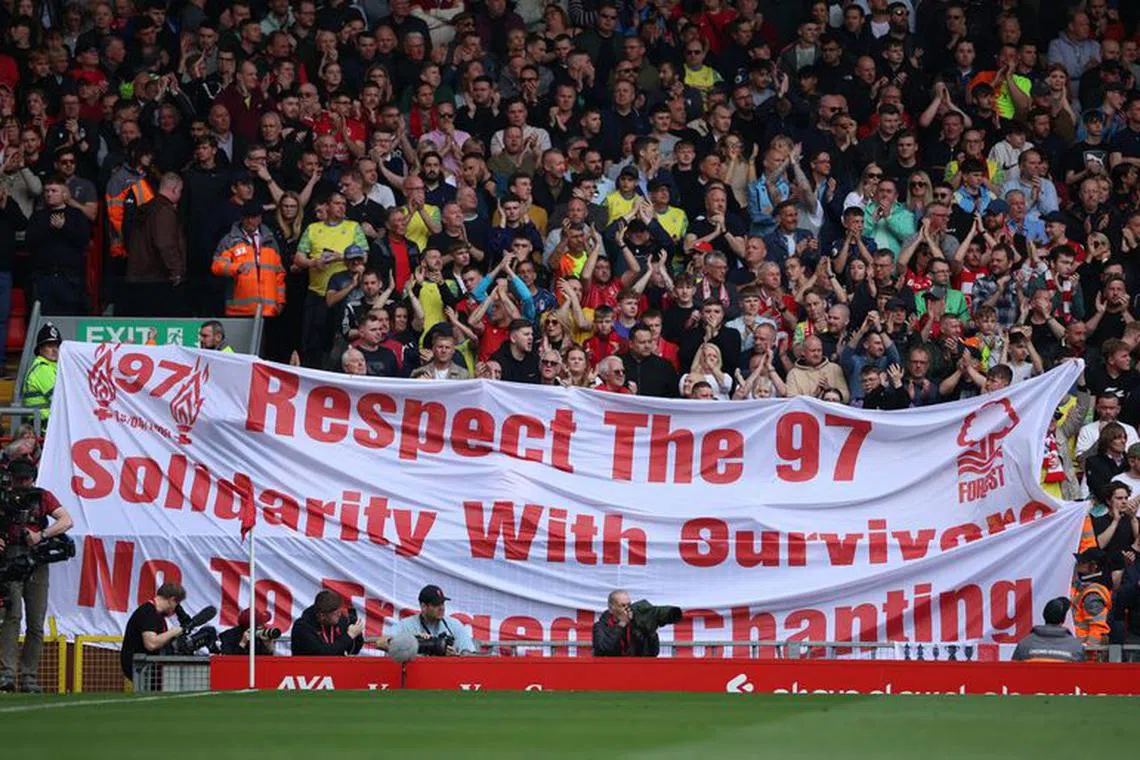 FILE PHOTO: Soccer Football - Premier League - Liverpool v Nottingham Forest - Anfield, Liverpool, Britain - April 22, 2023 Nottingham Forest fans hold up a banner in memory of the 97 victims of the Hillsborough disaster REUTERS/Phil Noble/File Photo
