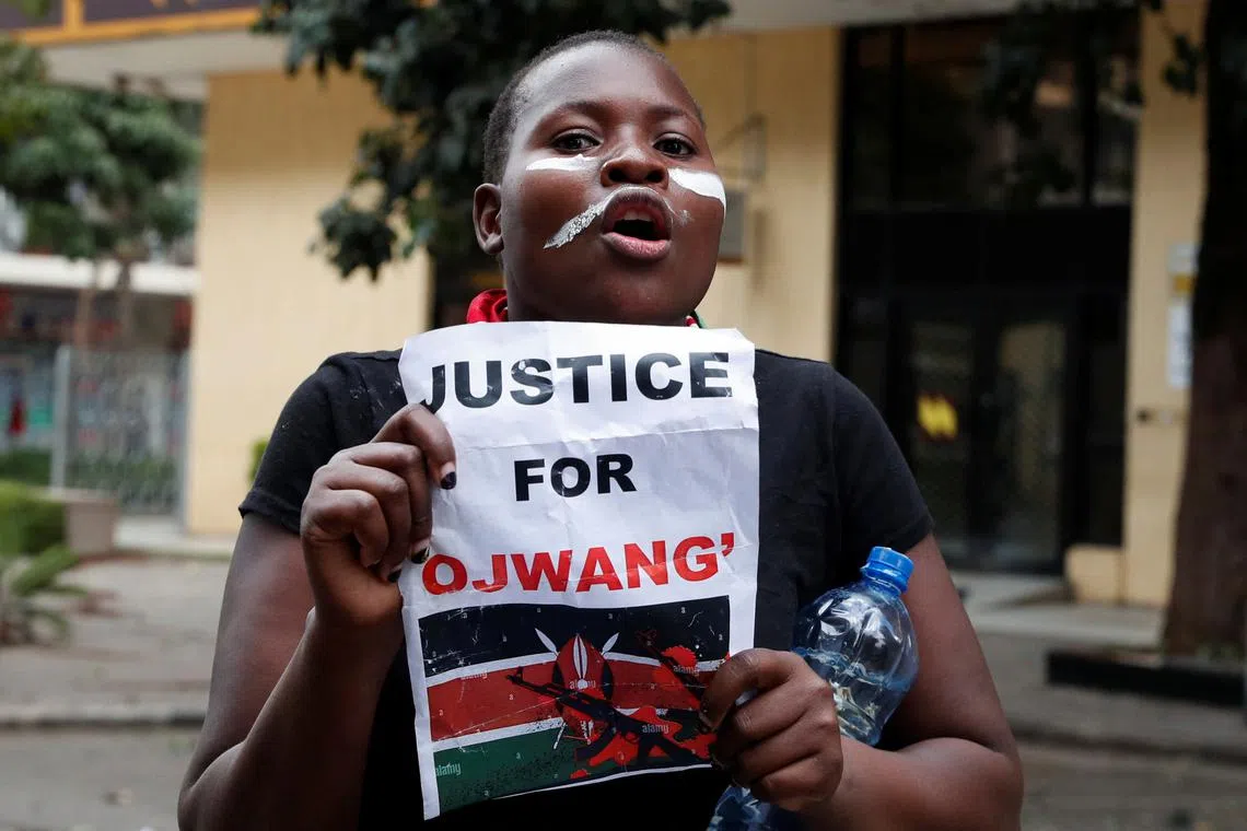 FILE PHOTO: A protestor reacts during a demonstration against the death of a blogger in police custody last week, in downtown Nairobi, Kenya June 12, 2025. REUTERS/Thomas Mukoya