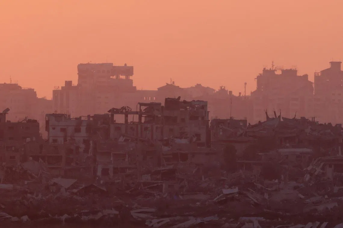 FILE PHOTO: A view of Gaza during sunset, amid the Israel-Hamas conflict, near the Israel-Gaza border, as seen from Israel, July 17, 2024. REUTERS/Ricardo Moraes/File Photo