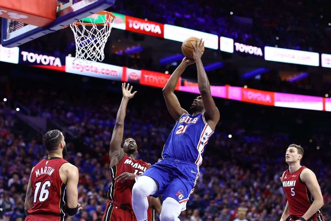 Joel Embiid of the Philadelphia 76ers shoots over Bam Adebayo of the Miami Heat during the first quarter of the Eastern Conference play-in game at the Wells Fargo Centre on April 17, 2024.