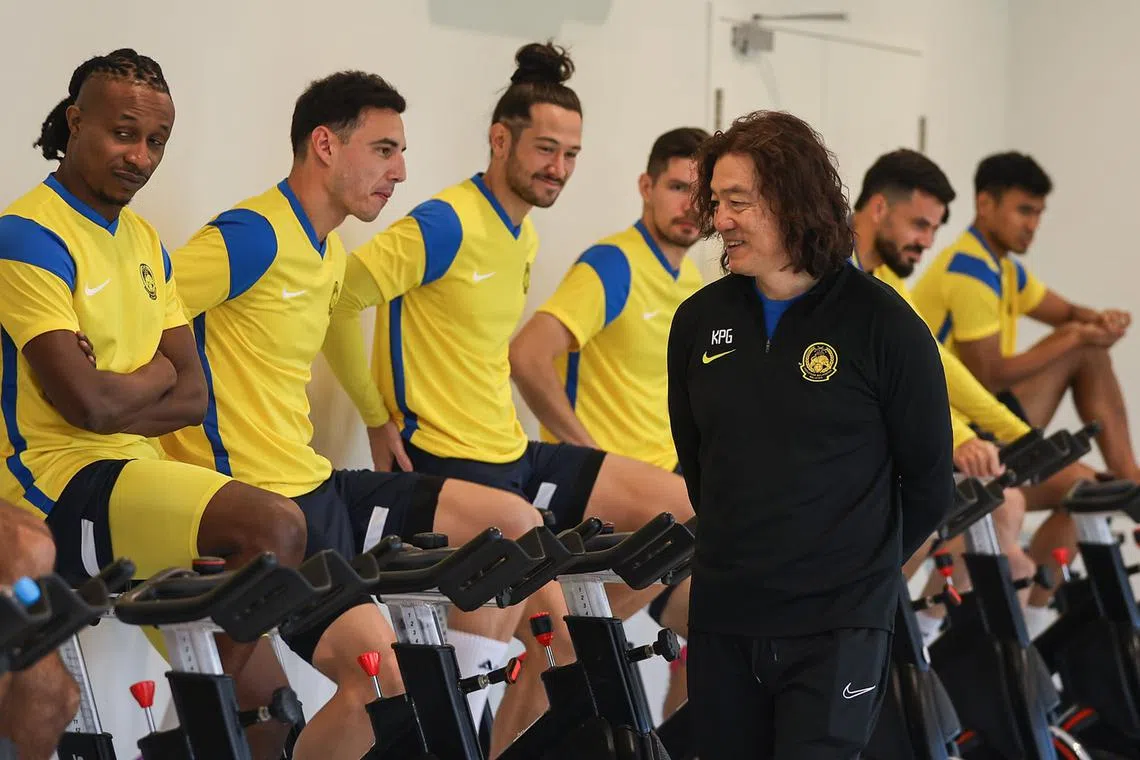 Malaysia coach Kim Pan-gon (in black) keeping a watchful eye as (from left) Mohamadou Sumareh, Dion Cools, Daniel Ting, Romel Morales, Paulo Josue and a local player go through a cycling session.