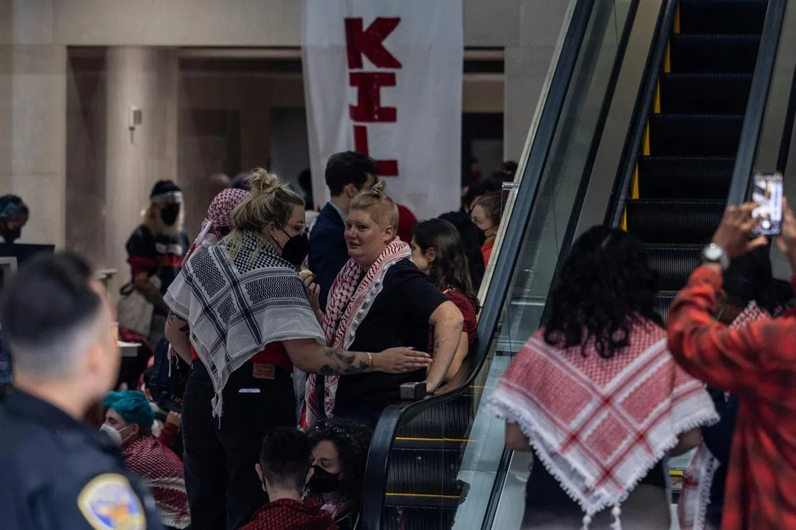 Pro-Palestinian protesters occupy the building lobby of the Israeli consulate, calling for a ceasefire in Gaza amid the ongoing conflict between Israel and Hamas, in downtown San Francisco, California, U.S., June 3, 2024. REUTERS/Carlos Barria