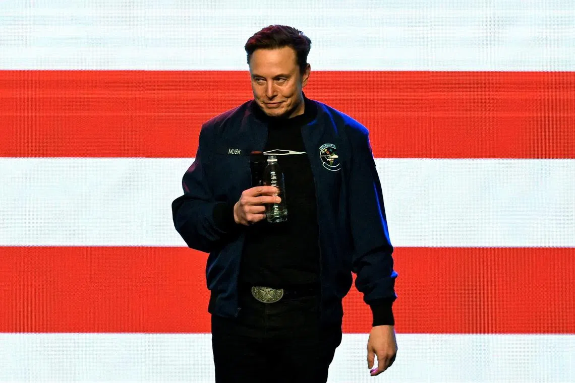 FILE PHOTO: U.S. President Donald Trump's adviser Elon Musk reacts on the day of a rally in support of a conservative state Supreme Court candidate of an April 1 election in Green Bay, Wisconsin, U.S. March 30, 2025.  REUTERS/Vincent Alban/File Photo