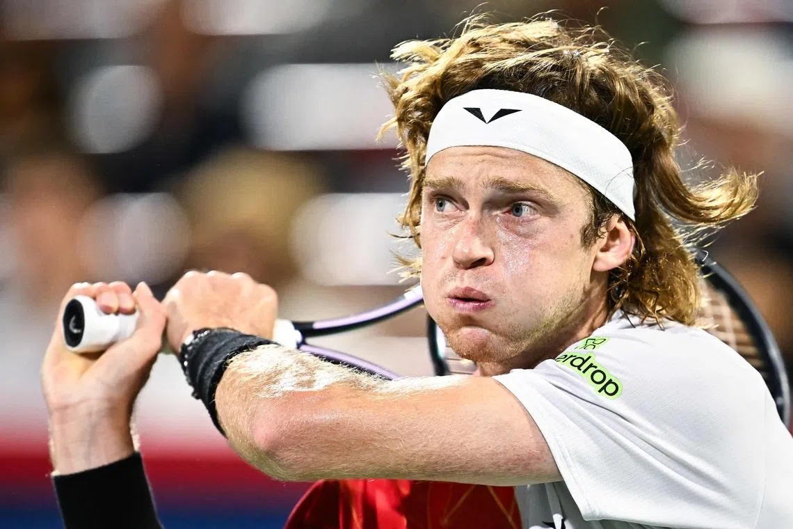 MONTREAL, CANADA - AUGUST 10: Andrey Rublev follows through with a backhand against Jannik Sinner of Italy in the Men's Singles quarterfinals round match during Day Five of the ATP Masters 1000 National Bank Open at Stade IGA on August 10, 2024 in Montreal, Canada.   Minas Panagiotakis/Getty Images/AFP (Photo by Minas Panagiotakis / GETTY IMAGES NORTH AMERICA / Getty Images via AFP)
