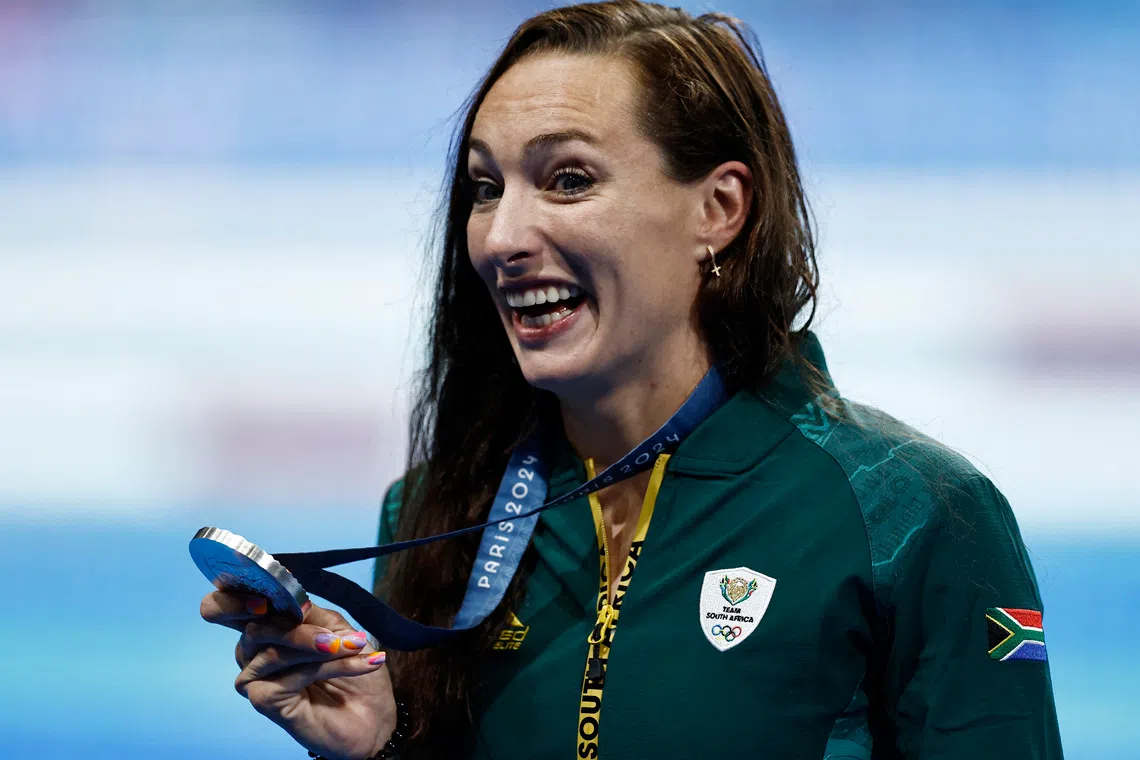 FILE PHOTO: Paris 2024 Olympics - Swimming - Women's 200m Breaststroke Victory Ceremony - Paris La Defense Arena, Nanterre, France - August 01, 2024. Silver medallist Tatjana Smith of South Africa celebrates on the podium. REUTERS/Clodagh Kilcoyne/File Photo