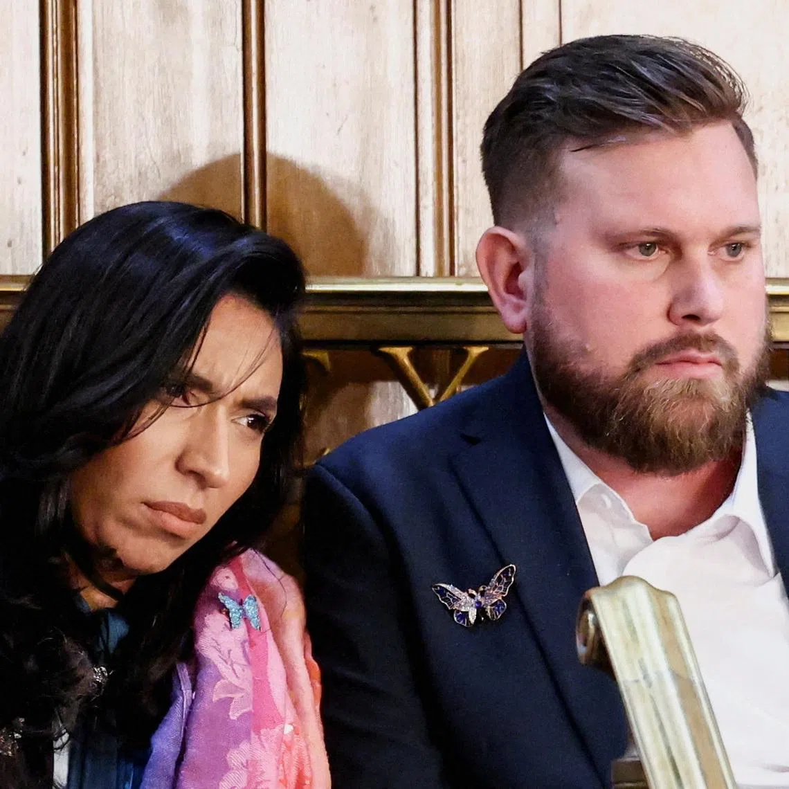 Sky and Amanda Roberts, the brother and sister-in-law of the late Virginia Roberts Giuffre, a survivor of Jeffrey Epstein’s international trafficking ring, react as U.S. President Donald Trump delivers the State of the Union address in the House Chamber of the U.S. Capitol in Washington, D.C., U.S., February 24, 2026.  REUTERS/KEVIN LAMARQUE