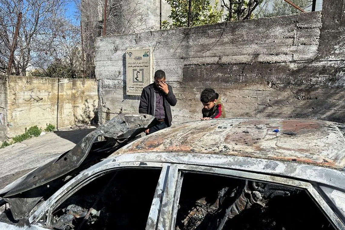 File photo: Palestinians check a damaged car following an Israeli settlers' attack in Asira Al-Qibiliya near Nablus in the Israeli-occupied West Bank February 13,2024. REUTERS/Ali Sawafta/File photo