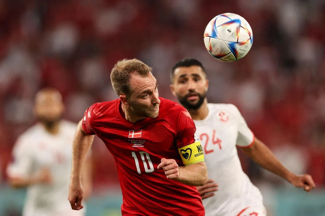 Denmark midfielder Christian Eriksen and Tunisia defender
Ali Abdi fight for the ball during the World Cup Group D match on Nov 22, 2022.