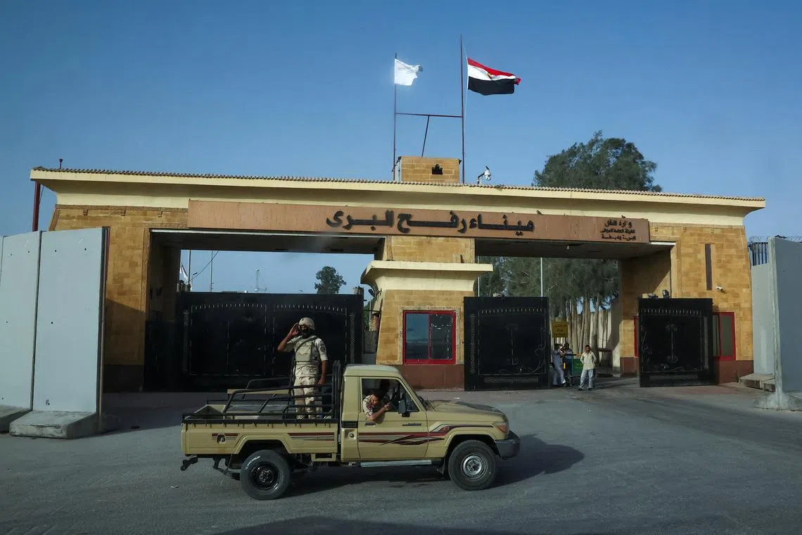 Egyptian soldiers stand guard near the Rafah Crossing at the Egypt-Gaza border, in Rafah, Egypt, July 4, 2024. REUTERS/Amr Alfiky/File Photo