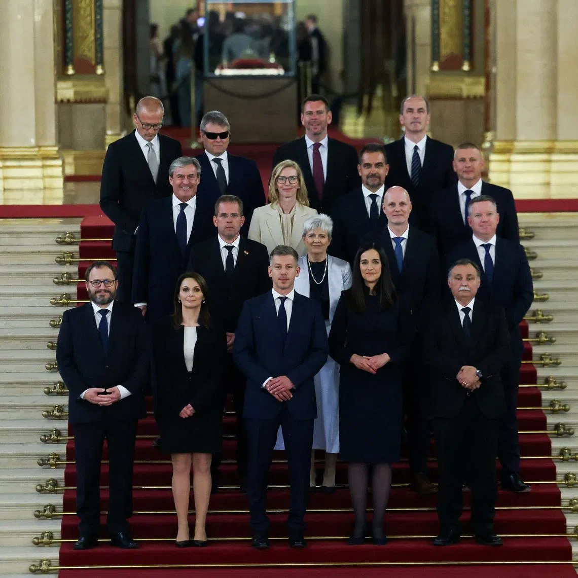 FILE PHOTO: Hungarian Prime Minister Peter Magyar and new members of government, Finance Minister Andras Karman, Minister of Regional and Rural Development Viktoria Lorinc, Foreign Minister Anita Orban, Minister for the Living Environment Laszlo Gajdos, PM's Chief of Staff Balint Ruff, Children and Education Minister Judit Lannert, Science and Technology Minister Zoltan Tanacs, Interior Minister Posfai Gabor, Economy and Energy Affairs Minister Istvan Kapitany, Justice Minister Marta Gorog, Agriculture and Food Minister Szabolcs Bona, Defence Minister Romulusz Ruszin-Szendi, Social Relations and Culture Minister Zoltan Tarr, Social and Family Affairs Minister Vilmos Katai-Nemeth,  Minister of Transport and Investment David Vitezy and Health Minister Zsolt Hegedus, pose for a family photo in the Parliament, in Budapest, Hungary, May 12, 2026. REUTERS/Bernadett Szabo/File photo