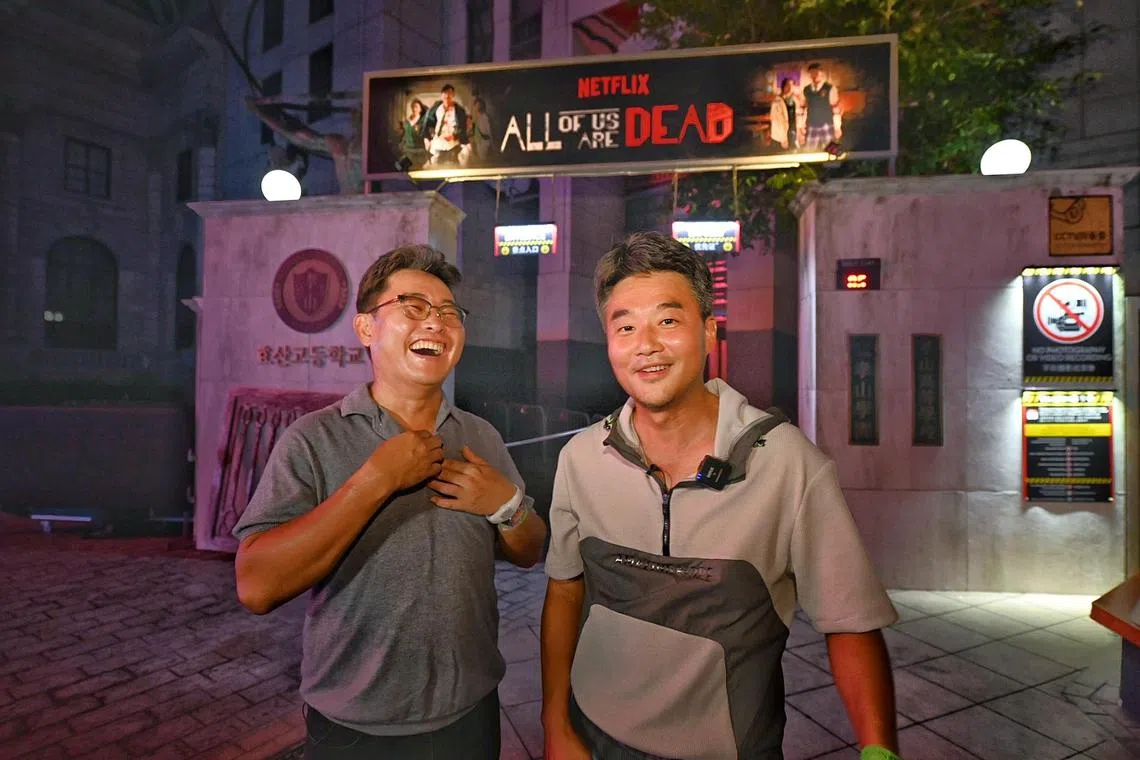 K-drama All Of Us Are Dead's producer Charles Park and director JQ Lee were scared by zombies at a haunted house inspired by their hit show at Universal Studios Singapore's Halloween Horror Nights.