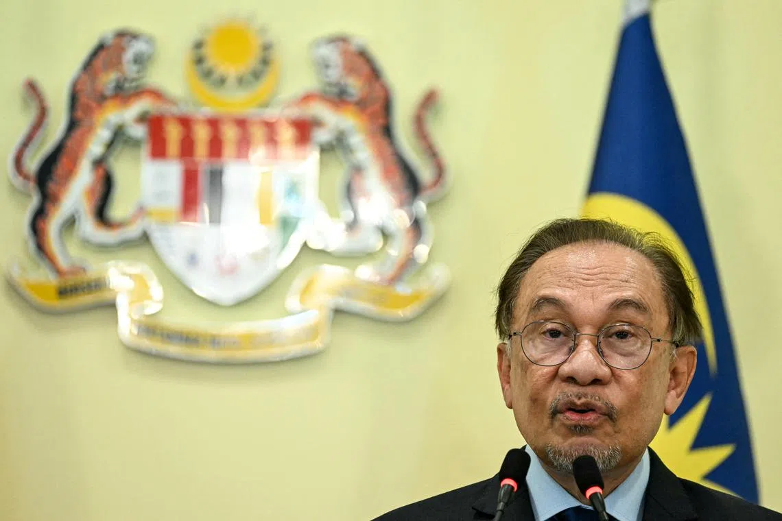 Malaysia's Prime Minister Anwar Ibrahim speaks during a press conference with Vietnam's communist party general secretary To Lam (unseen) at the Federal Government office \"Putra Perdana\" in Putrajaya near Kuala Lumpur on November 21, 2024.     MOHD RASFAN/Pool via REUTERS/File Photo