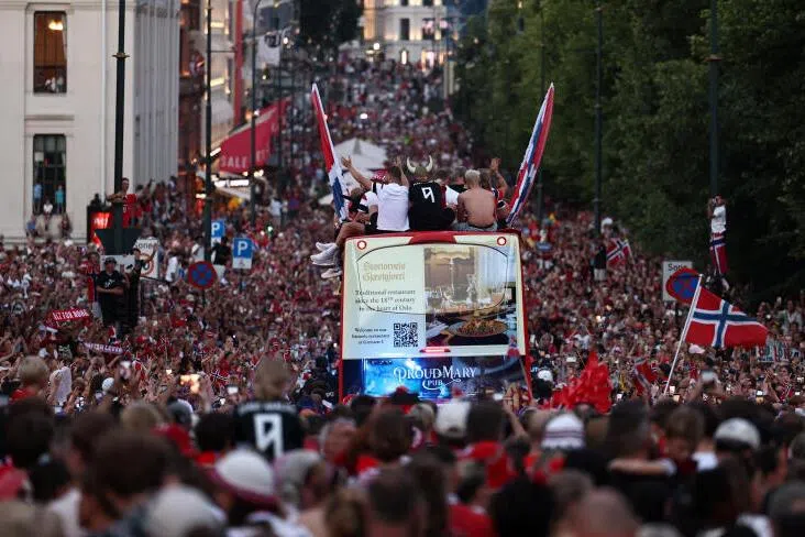 Members of the Norwegian men’s football team and their staff take part in an open-top bus parade through the streets to celebrate their performance in the World Cup after returning to Oslo, Norway, July 13, 2026. REUTERS/Tom Little