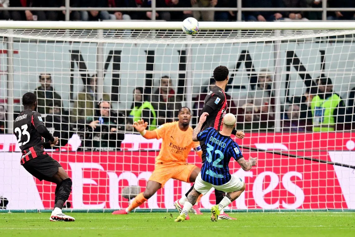 Soccer Football - Serie A - AC Milan v Inter Milan - San Siro, Milan, Italy - March 8, 2026 Inter Milan's Federico Dimarco shoots at goal. REUTERS/Daniele Mascolo