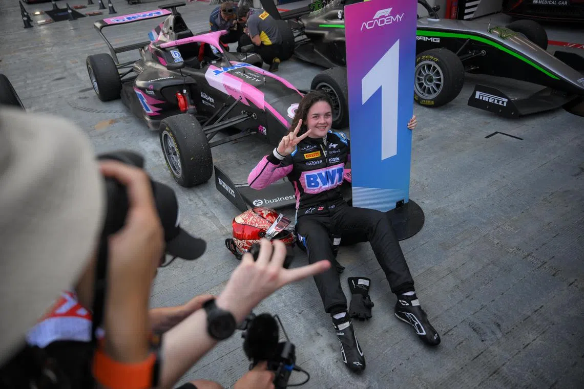Alpine’s Abbi Pulling celebrating after winning the F1 Academy second race at the Marina Bay Street Circuit on Sept 22. She won the overall title in Doha on Nov 30.
