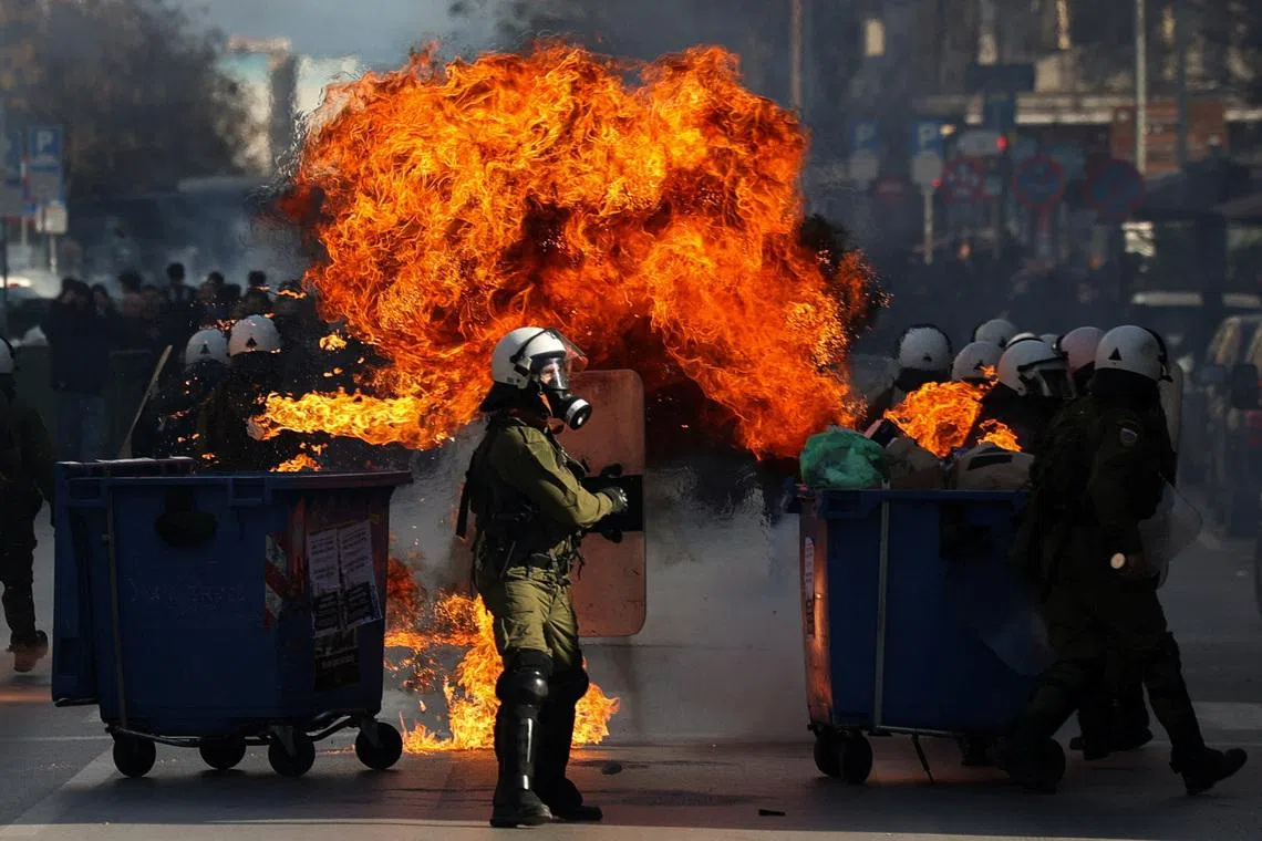 A Molotov cocktail explodes near riot police during clashes at a demonstration marking the anniversary of the 2023 deadly train crash in Tempi, the country's worst railway disaster on record, in Thessaloniki, Greece, February 28, 2026. REUTERS/Alexandros Avramidis