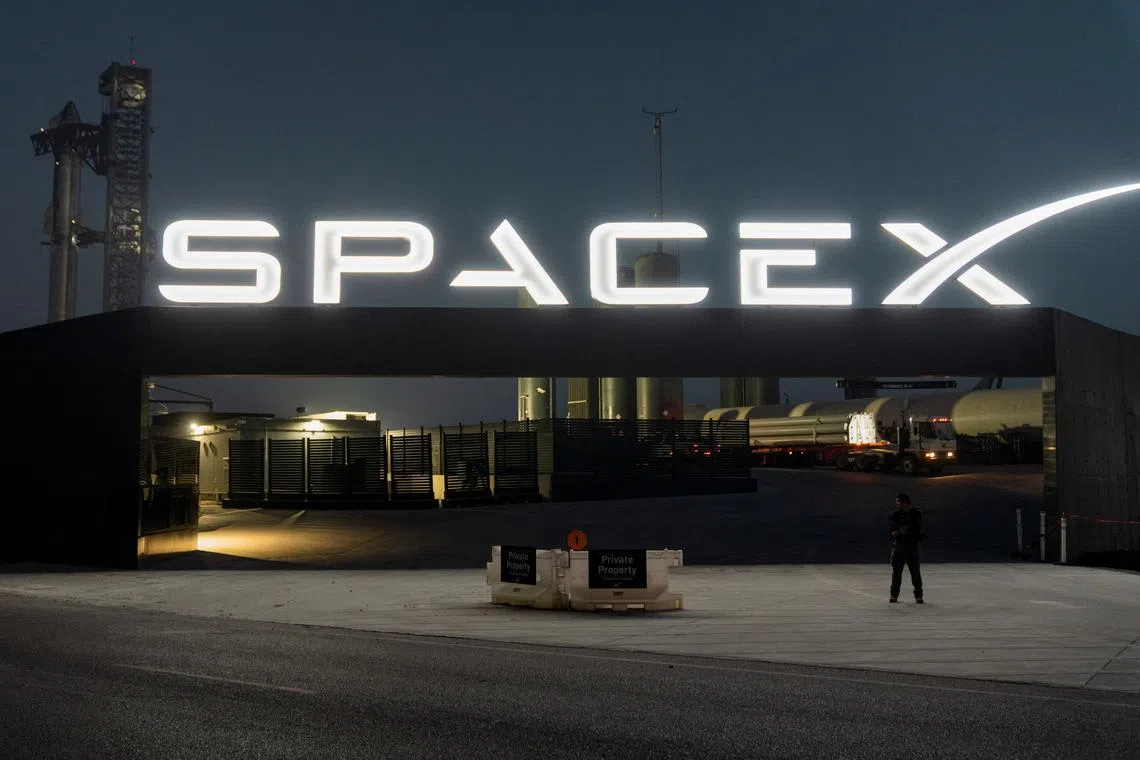 FILE PHOTO: A security guard monitors the entrance as SpaceX's next-generation Starship spacecraft atop its powerful Super Heavy rocket is prepared for a third launch from the company's Boca Chica launchpad on an uncrewed test flight, near Brownsville, Texas, U.S. March 13, 2024. REUTERS/Cheney Orr/FILE PHOTO