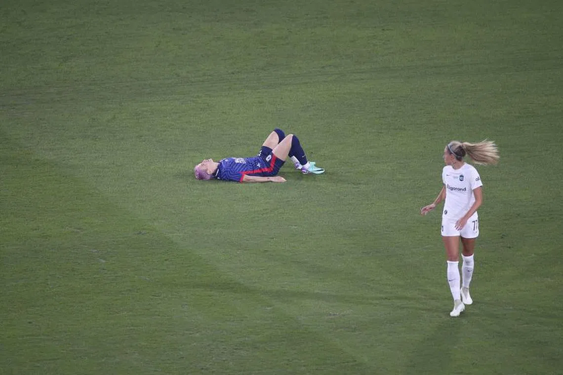 Nov 11, 2023; San Diego, California, USA;  OL Reign forward Megan Rapinoe (15) lays on the pitch following an injury in the opening minutes against New Jersey/New York Gotham FC at Snapdragon Stadium. Mandatory Credit: Amber Searls-USA TODAY Sports