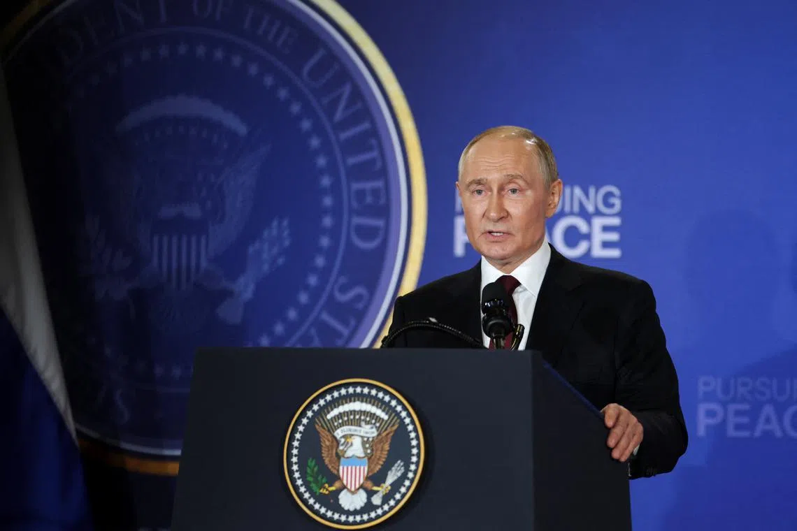 Russian President Vladimir Putin holds a press conference with U.S. President Donald Trump following their meeting to negotiate an end to the war in Ukraine, at Joint Base Elmendorf-Richardson in Anchorage, Alaska, U.S., August 15, 2025. REUTERS/Jeenah Moon