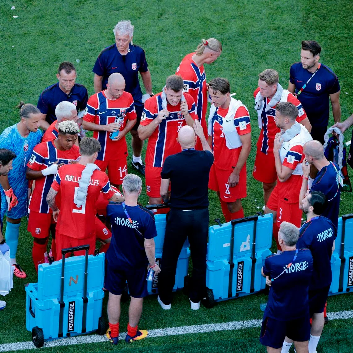 The Norway national team discussing tactics during a hydration break at the 2026 World Cup. The breaks, which occur once in each half, became one of the tournament’s most contentious talking points.